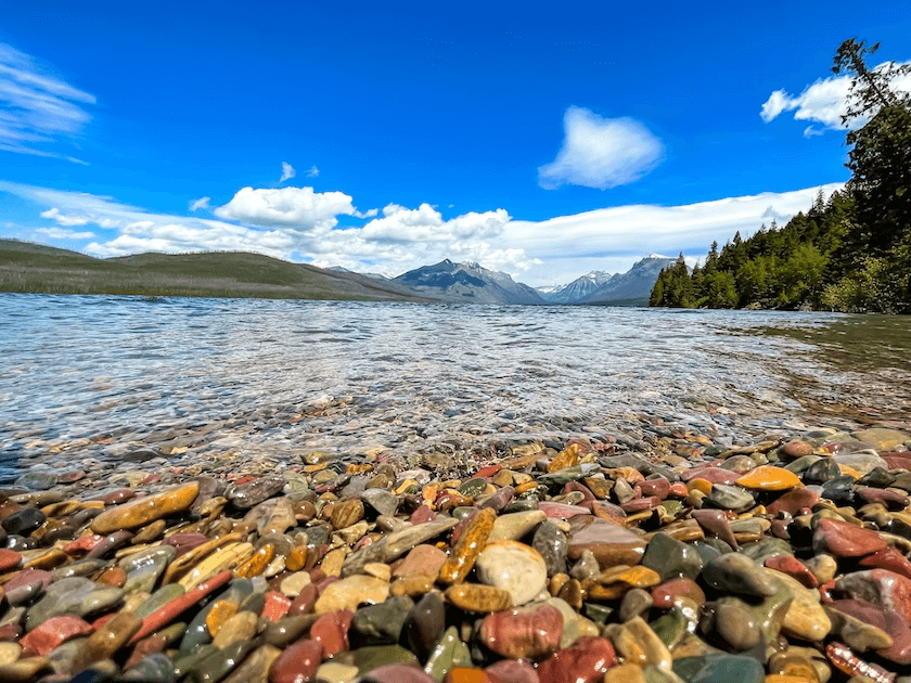 The beautiful rainbow rocks of Lake McDonald (one of the best places to visit in Montana)