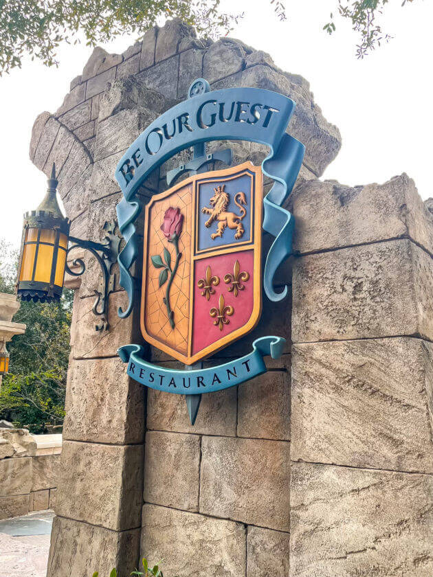 Be Our Guest restaurant sign outside beauty and the beast castle restaurant