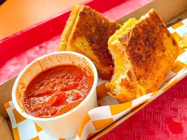 Grilled cheese sandwich and a cup of tomato soup from Woody's lunchbox in Disney World