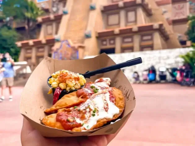 Beef empanadas with crema and a side of street corn in Mexico area of Epcot in Disney World