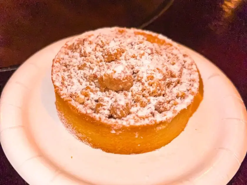 Baked apple tart covered with powdered sugar from Epcot's Canada area in Disney World