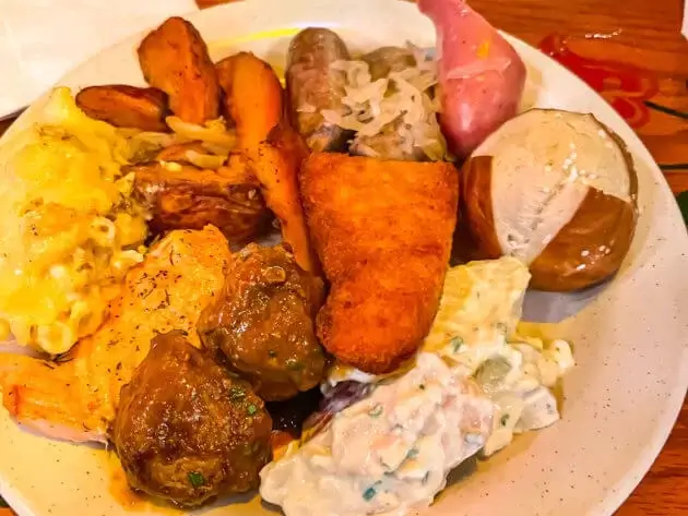 Plate of various German dishes from Biergarten in Epcot in Disney World