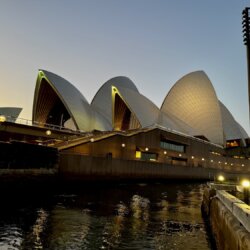 Sydney Opera House lit up in the evening after sunset