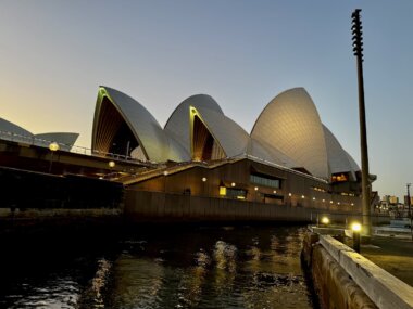 Sydney Opera House lit up in the evening after sunset