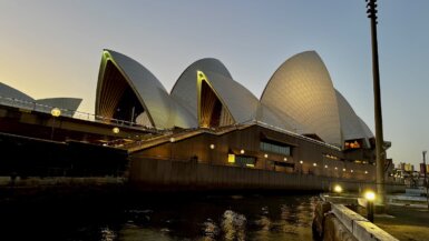 Sydney Opera House lit up in the evening after sunset